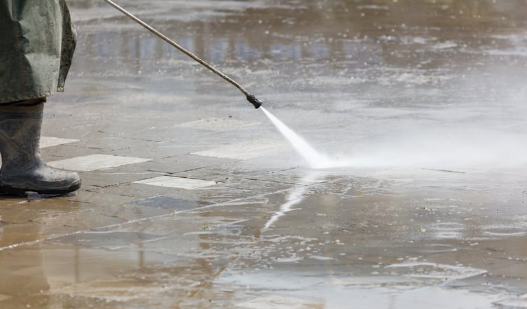 Pressure washing sidewalk